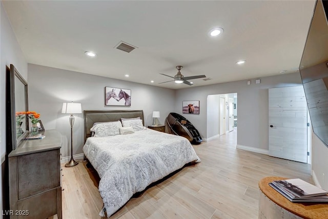 bedroom with ceiling fan and light hardwood / wood-style flooring