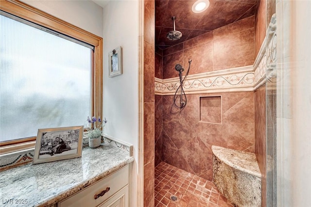 bathroom with tiled shower