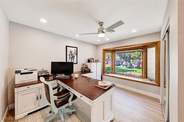 office area featuring light wood-type flooring and ceiling fan