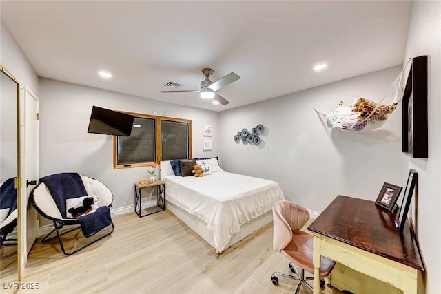 bedroom featuring ceiling fan and light hardwood / wood-style floors