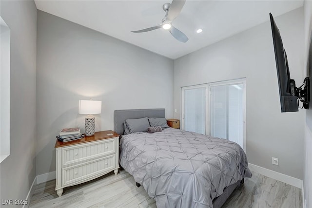 bedroom with ceiling fan and light hardwood / wood-style floors