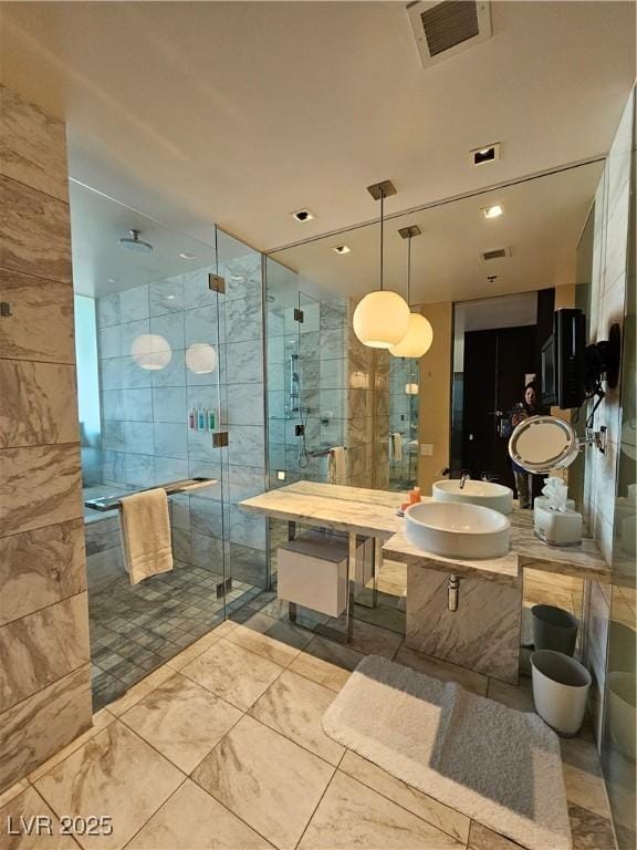 bathroom with walk in shower and vanity