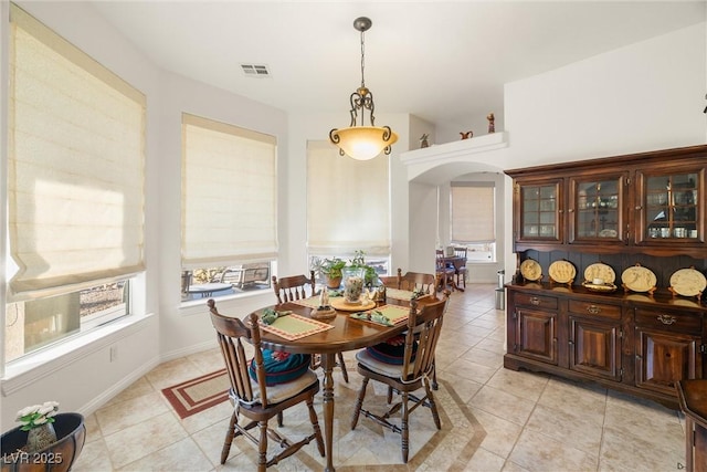 tiled dining area with a healthy amount of sunlight