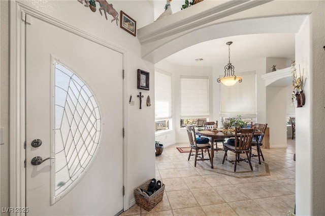 foyer entrance featuring light tile patterned floors