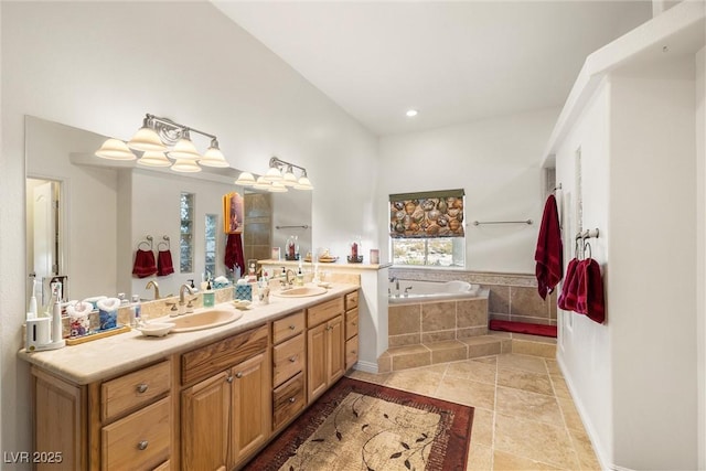 bathroom with a relaxing tiled tub and vanity