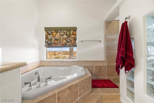 bathroom featuring a relaxing tiled tub