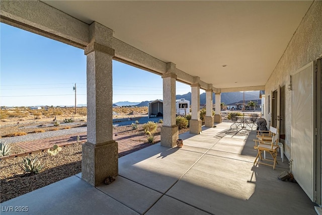 view of patio featuring a mountain view