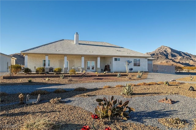 rear view of property with a mountain view