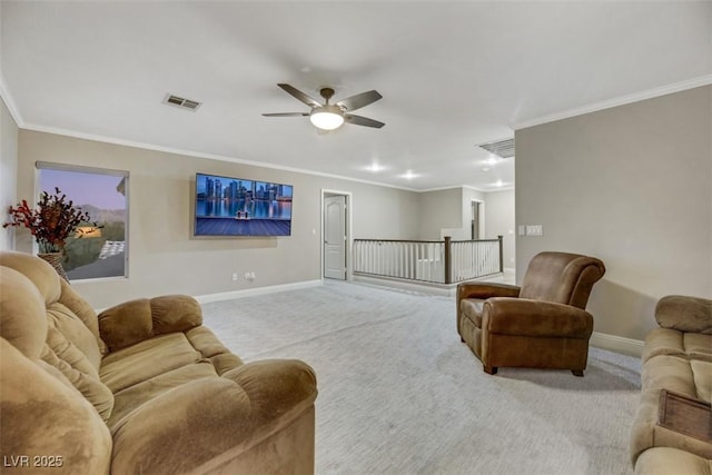 living room with ceiling fan, crown molding, and carpet flooring