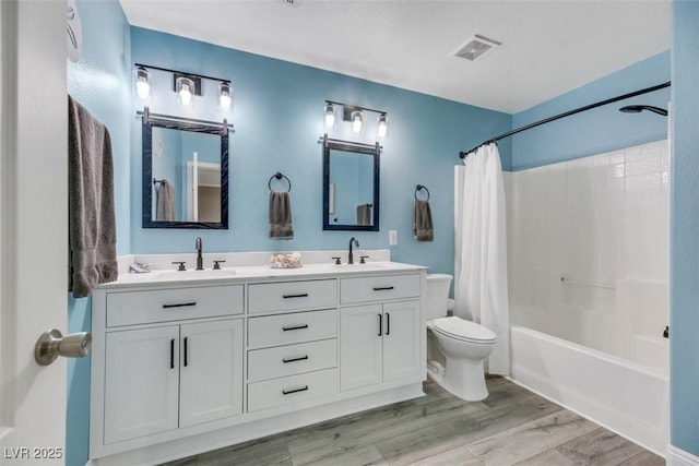 full bathroom with toilet, shower / tub combo, vanity, and hardwood / wood-style flooring