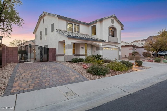 mediterranean / spanish-style house featuring a garage