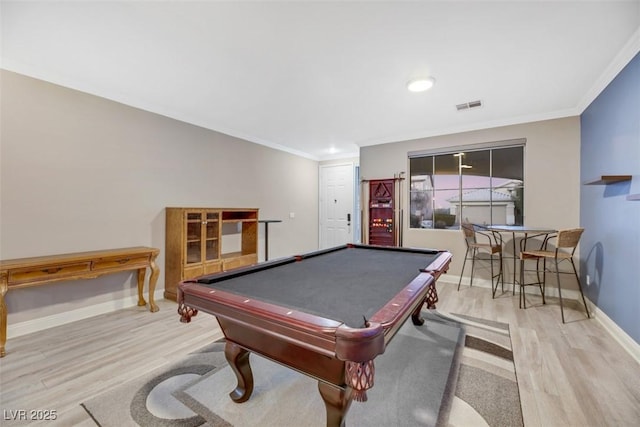 rec room with billiards, light hardwood / wood-style flooring, and ornamental molding