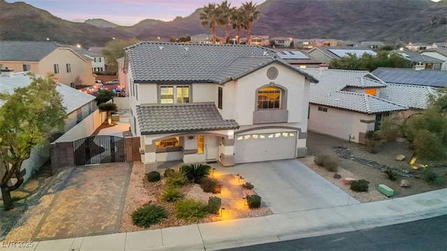 view of front of house featuring a mountain view and a garage