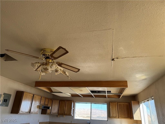 interior details featuring ceiling fan