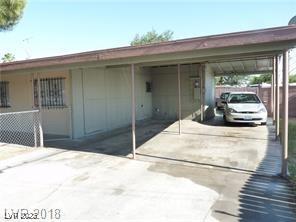 exterior space with a carport