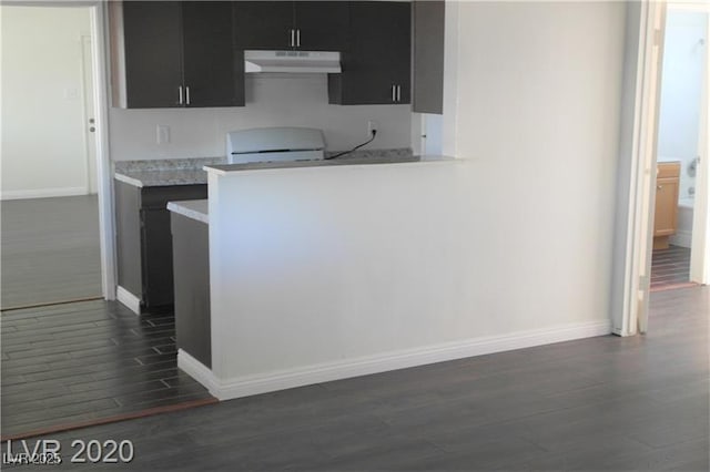 kitchen with dark hardwood / wood-style flooring and range