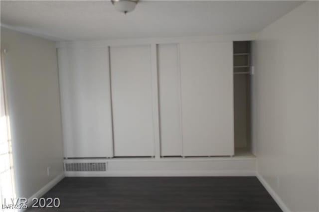 empty room featuring dark hardwood / wood-style floors