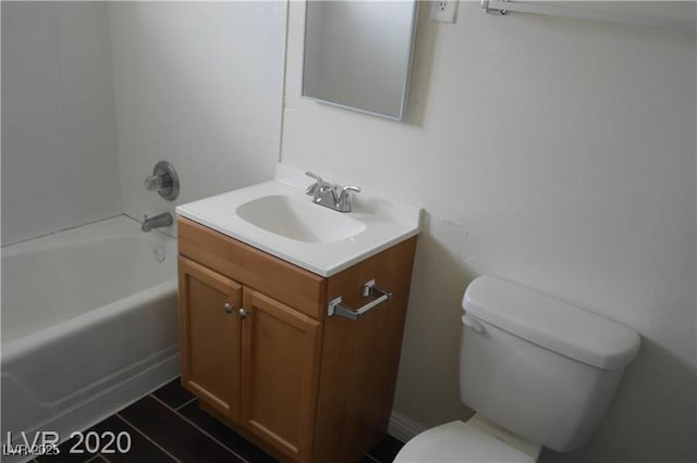 full bathroom featuring toilet, tub / shower combination, and vanity