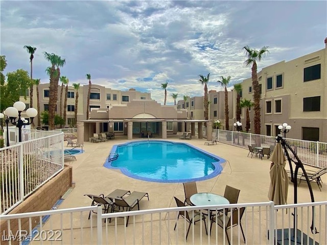 view of pool featuring a patio