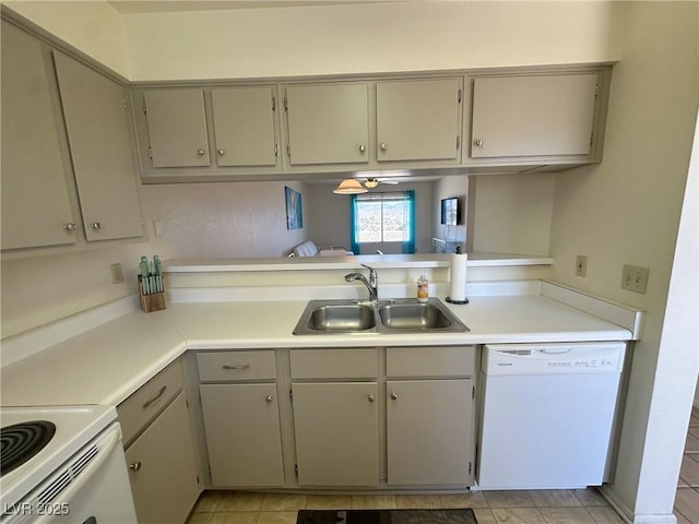 kitchen with ceiling fan, sink, white appliances, light tile patterned flooring, and gray cabinetry