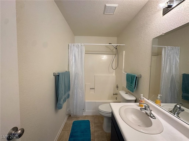 full bathroom with a textured ceiling, tile patterned floors, vanity, shower / tub combo, and toilet