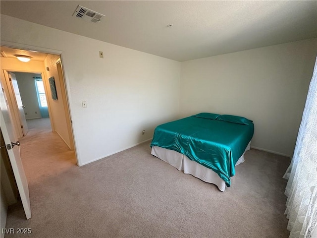 bedroom featuring light colored carpet