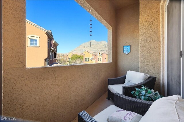 balcony featuring a mountain view