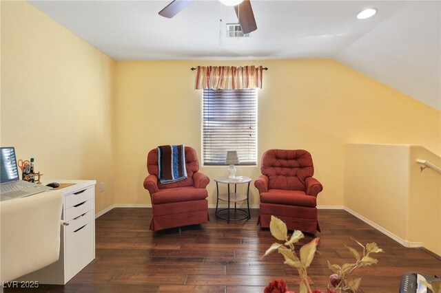 living area with ceiling fan, dark wood-type flooring, and lofted ceiling