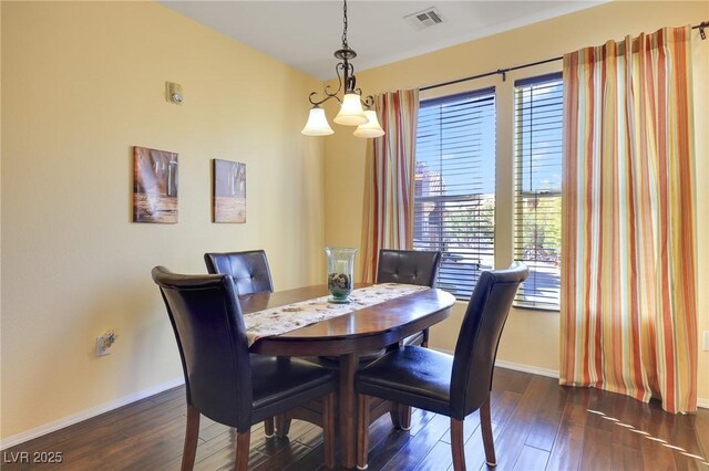 dining area featuring dark hardwood / wood-style flooring