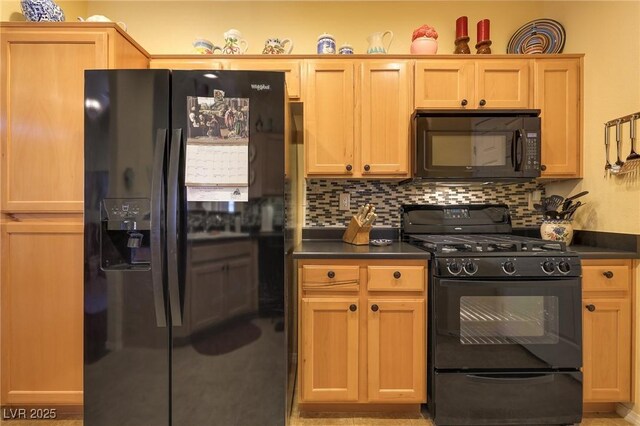 kitchen featuring light brown cabinets, black appliances, and tasteful backsplash