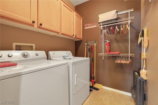 laundry room featuring cabinets, radiator, washing machine and dryer, and light tile patterned flooring