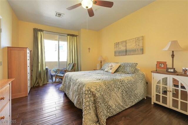 bedroom featuring ceiling fan and dark hardwood / wood-style floors