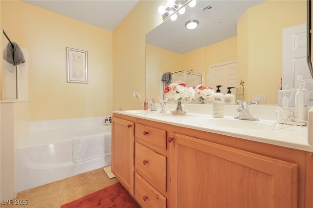 bathroom with shower with separate bathtub, vanity, and tile patterned flooring