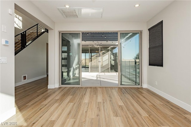 unfurnished room featuring hardwood / wood-style floors