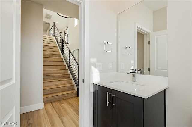 bathroom featuring hardwood / wood-style flooring and vanity