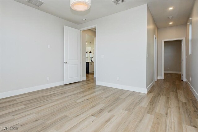 unfurnished room with light hardwood / wood-style flooring