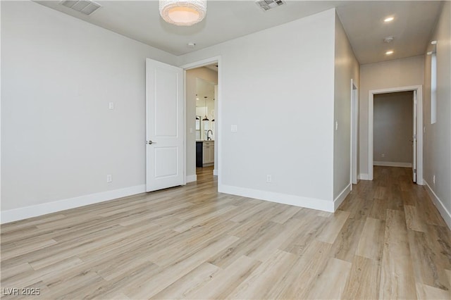 unfurnished room featuring light hardwood / wood-style floors