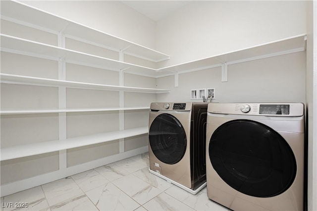 washroom featuring washing machine and dryer