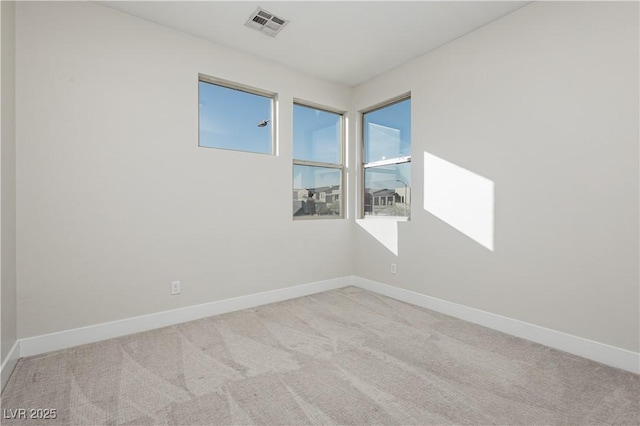 unfurnished room with light carpet