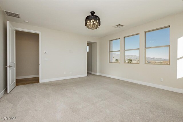 unfurnished bedroom with light colored carpet