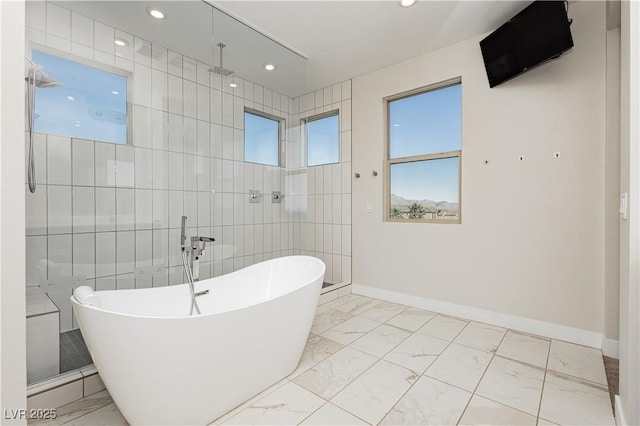 bathroom with independent shower and bath and tile walls