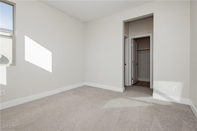 unfurnished bedroom with light carpet