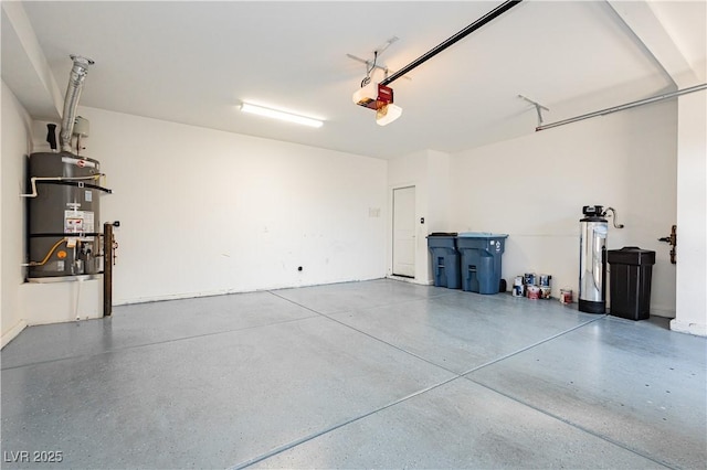 garage with a garage door opener and water heater