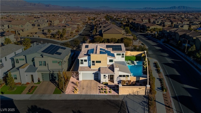 birds eye view of property featuring a mountain view