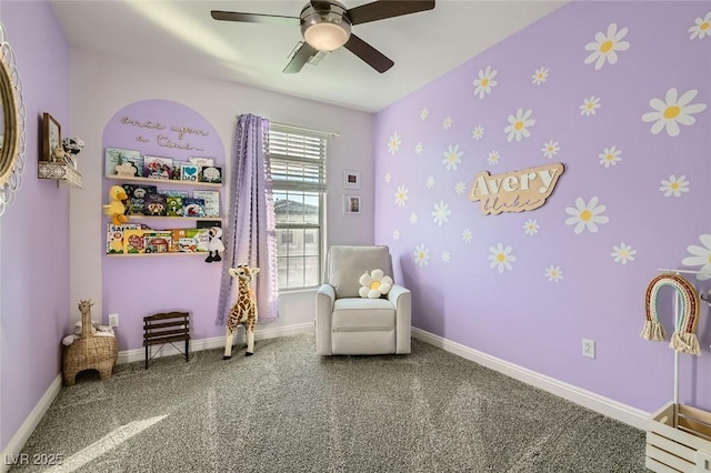 living area with ceiling fan and carpet flooring