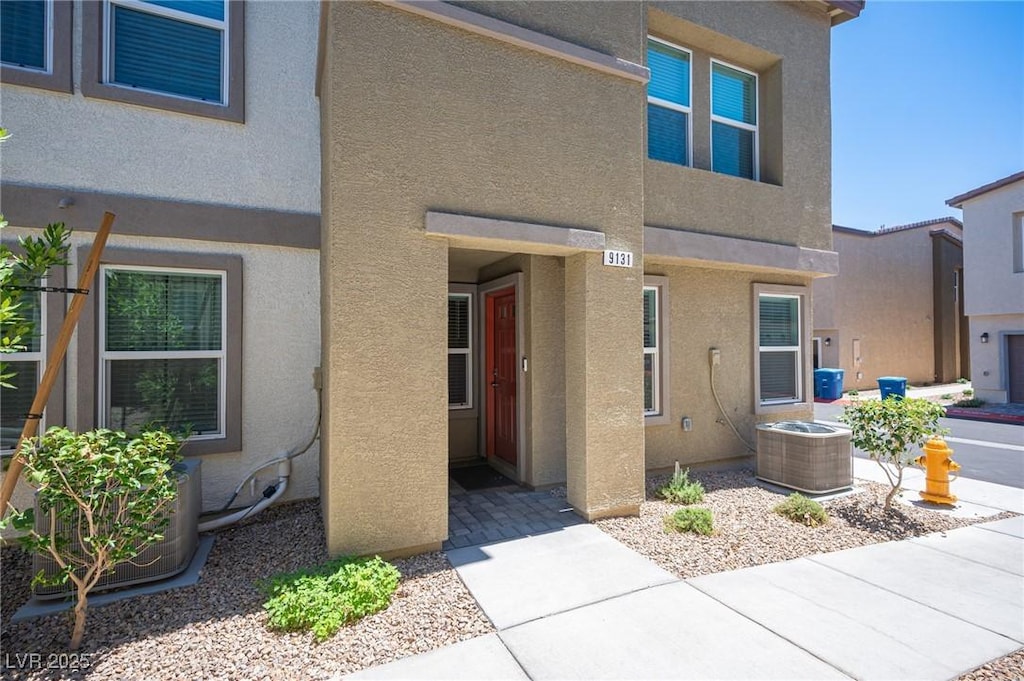 view of front of home featuring cooling unit