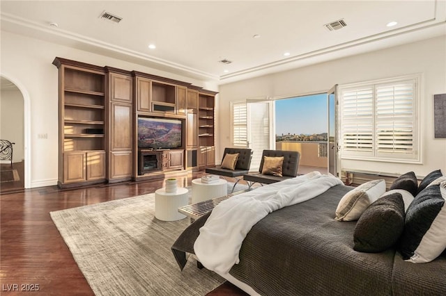 bedroom with dark hardwood / wood-style flooring