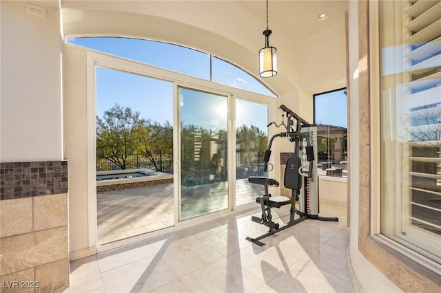 exercise room featuring light tile patterned flooring