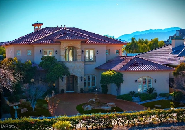 back of house with a mountain view