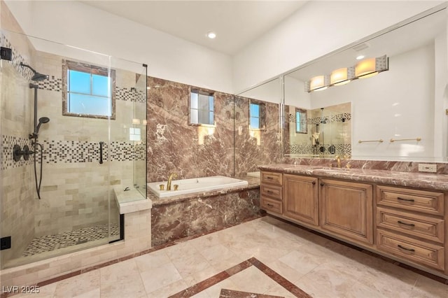 bathroom featuring plus walk in shower and vanity